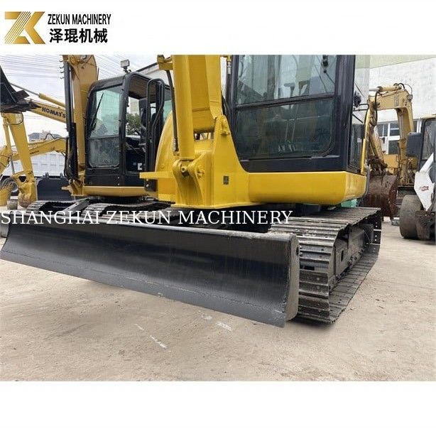 Komatsu PC56-7 เครื่องขุดขนาดเล็กที่มีน้ําหนักในการทํางาน 5 ตันและเครื่องยนต์ดีเซลที่ทนทาน